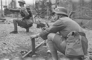 Nationalist soldiers with Mausers (or similar), amid barbed wire