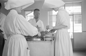 Nurses dishing up food for hospital patients, Shanghai