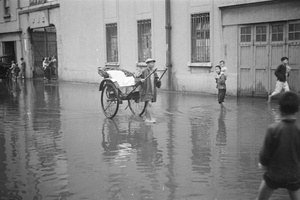 Walking through flood waters, Shanghai