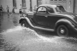 Car driving through flood waters, Shanghai