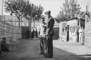 Street seller, onlookers and American marine, Shanghai