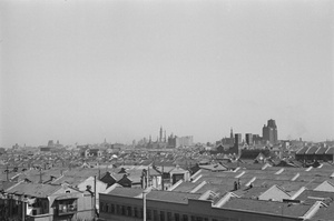 People on rooftop watching fires, Shanghai