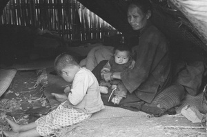 Woman and children in temporary shelter, Shanghai