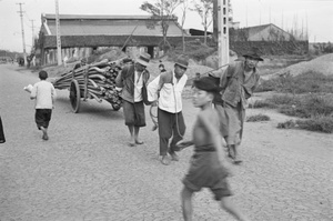 Three men hauling a cart, Shanghai