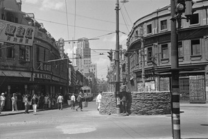 Sandbagged guard post, at a Foochow Road (Fuzhou Lu), road junction, Shanghai