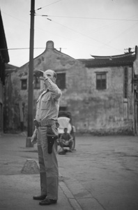 American Marine drinking from a bottle, Shanghai