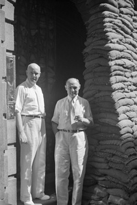 Bank staff outside sandbagged Chase Bank, Kiukiang Road, Shanghai