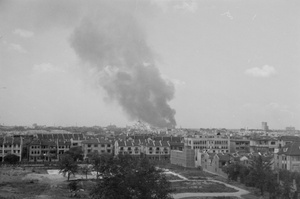 Smoke rising beyond Park Ravinel, Shanghai