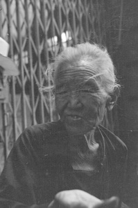 Elderly Chinese woman begging, Shanghai