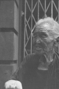 Elderly Chinese woman begging, Shanghai