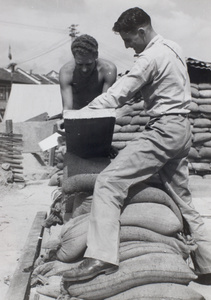 American Marines sawing a plank of wood, Shanghai