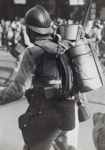 French soldier carrying kit including cooking pots and hobnail boots, Shanghai