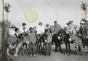 Group travelling by donkey to the Ming Tombs, near Peking