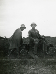 Chinese man travelling by wheelbarrow