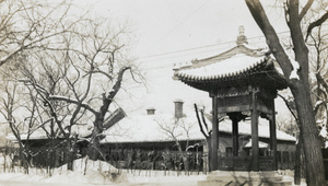 Snow-topped pavilion and large buildings