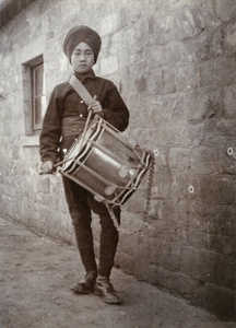 Drummer boy, in winter uniform, 1st Chinese Regiment