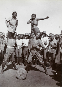 Soldiers showing their strength, 1st Chinese Regiment