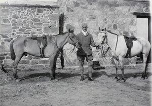 European man with two horses