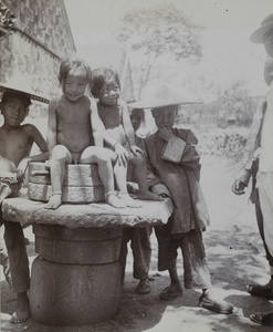 Children and grain mill