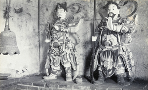 Temple guardians (shrine figures) and a bell
