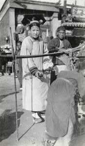 Manchu woman with fruit vendor