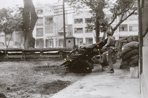 Soldier and defences around a building, Canton, June 1925