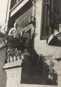 A couple outside a house in Fanling Road, Hankow