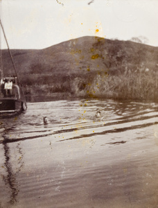 Two men swimming in December