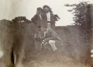 John Sullivan and two others greet a child