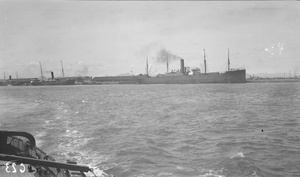Wharves at Dalny ( 大连) with a Hapag freighter and two small NYK passenger steamers