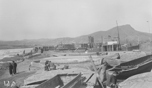 Tug 'Yungling' (永陵) and lighters in dock, Antung