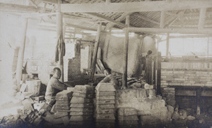 Workers at a crude furnace, New Wah Chang Co., Hsi Kwan Shan (Xi guan shan?), Hong Kong