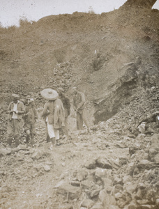 Workers near the entrance to a mine, China Mining & Metal Company Ltd., Chat Lo Teng