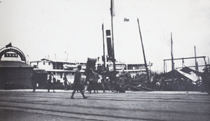 A pier with a British Canton Line sign, and a steamer, Hong Kong