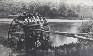 Waterwheel by a river