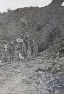 Workers near the entrance to a mine, China Mining & Metal Company Ltd., Chat Lo Teng