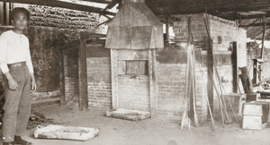 A worker at a crude furnace, China Mining & Metal Company Ltd., Shaoguan (韶關)