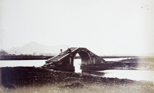 Mr. and Mrs. Reid on a bridge over one of Hill Creeks, near Shanghai