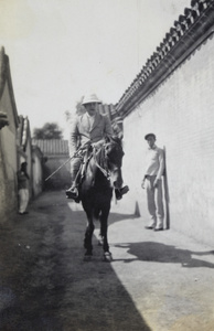 William Boyd Cooper on a horse, in Rotting Vegetable Street, Peking