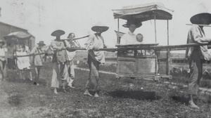 Sedan chairs with bearers and passengers