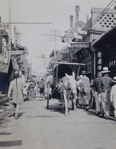 A Peking Cart in a shopping street, Peking