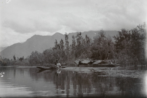 Thatched sampan on a river