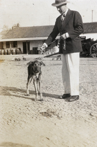 E.E. Wilkinson with a dog