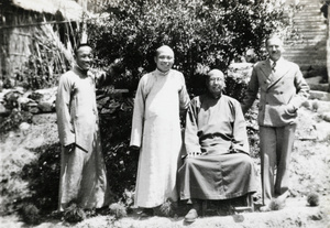 Three Chinese men with E.E. Wilkinson