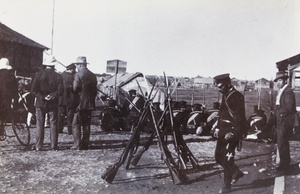 Stacked rifles, bayonets fixed, beside civilians and soldiers, Xinhai Revolution