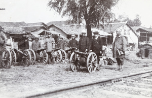 Revolutionary soldiers and field guns beside railway track