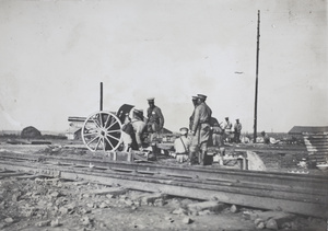 Qing army gun batteries beside railway tracks