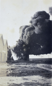 Standard Oil Company holding tank set on fire by a Qing navy shell