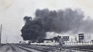 Standard Oil Company holding tank set on fire by a Qing navy shell