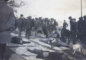 Dead Republican soldiers laid out on mats, British Concession, Hankow